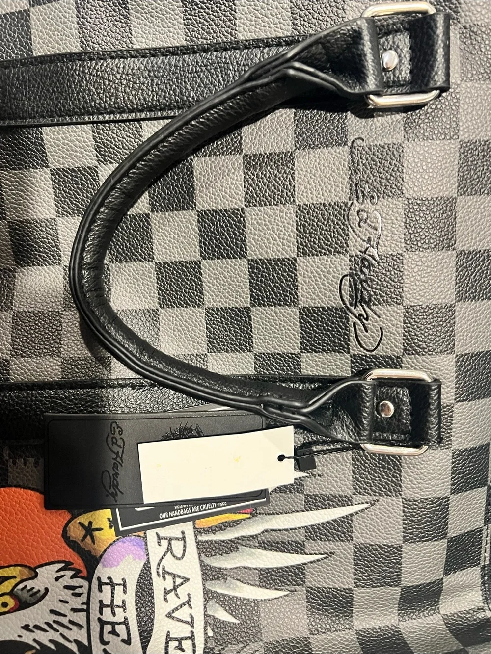 Ed Hardy duffel bag features a black and grey checkered pattern